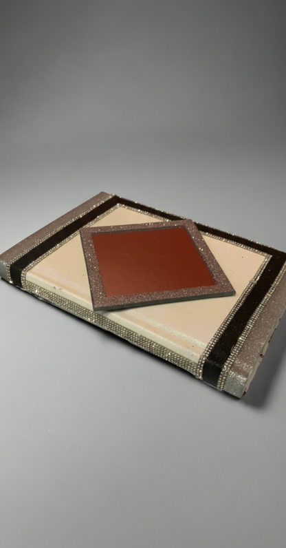 Decorative Book with mirrors with geometric pattern on a gray background