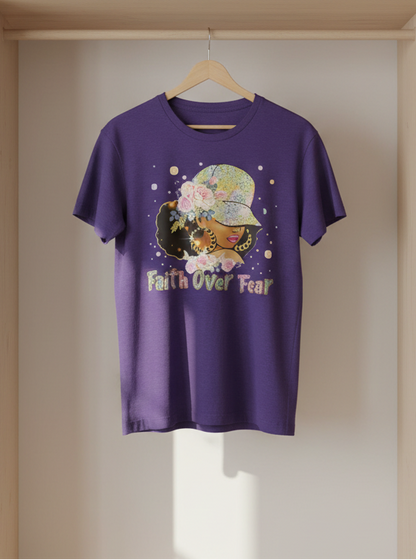 Purple t-shirt with a graphic design and text 'Faith Over Fear' hanging on a wooden rack.
