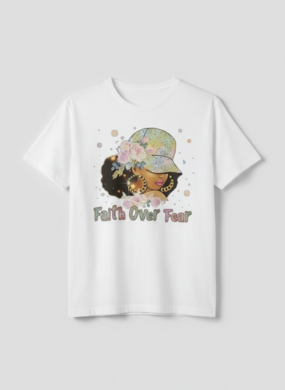 White t-shirt with a graphic of two women with braids and flowers, and 'Faith Over Fear' text on a white background.